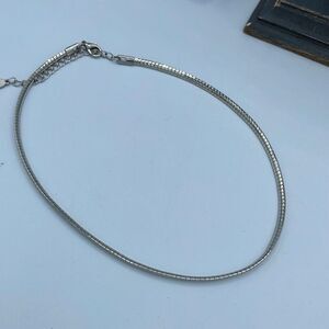 Belle Miss serpentine silver colored choker .